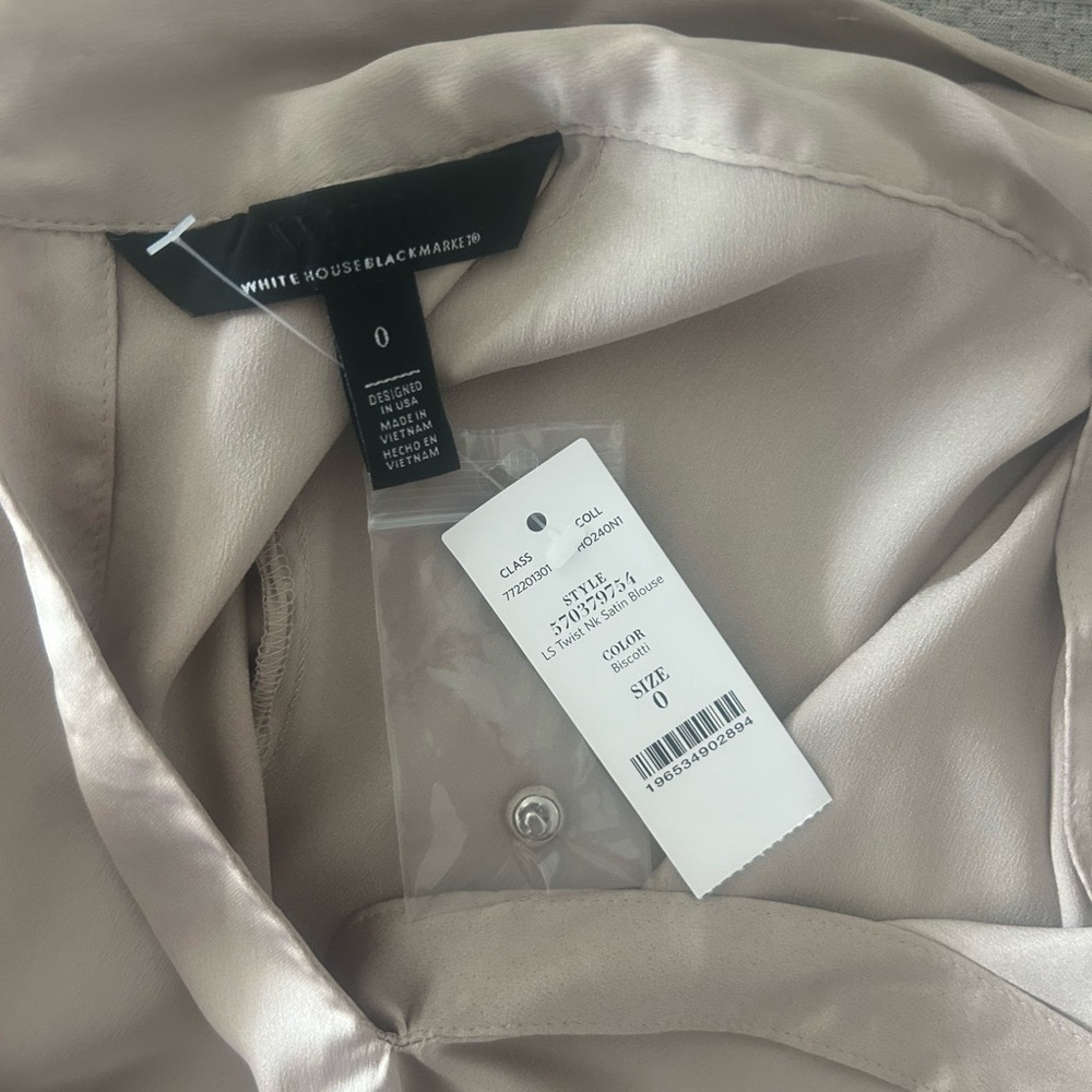 This satin blouse has a twisted neckline keyholes and blouson sleeves for flair - Picture 3 of 7